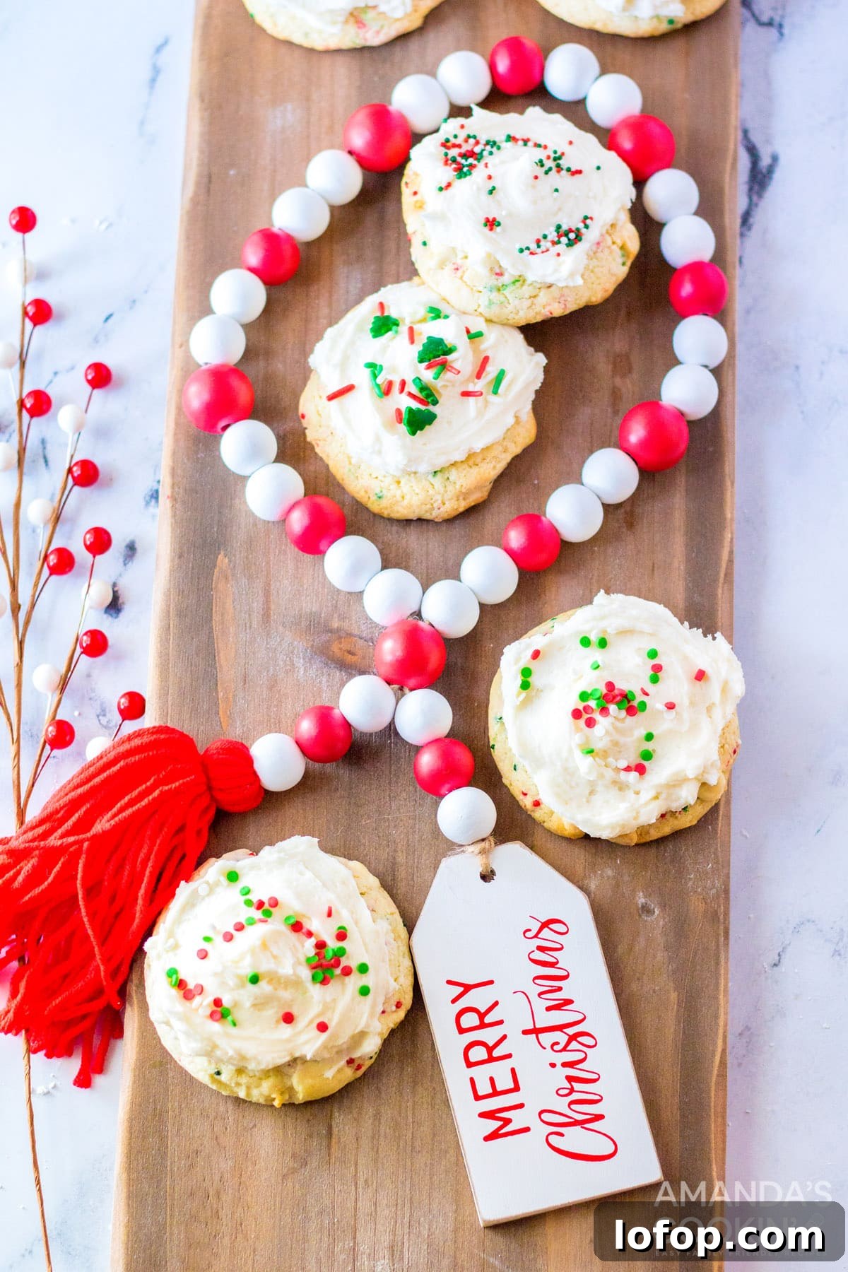 Funfetti Cake Mix Cookie Recipe for Soft, Chewy Treats 3 frosted cake mix cookies on cutting board