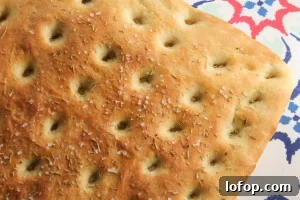 Soft and fluffy focaccia bread with rosemary and sea salt. It's so easy - perfect for a novice baker.