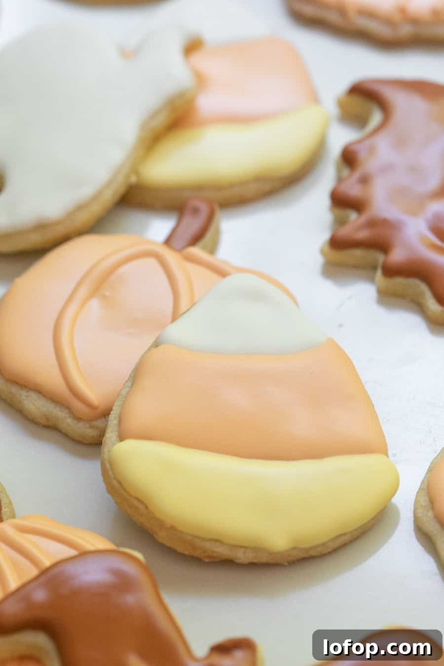 Spooky Halloween Sugar Cookie Recipe for Festive Treats 4 Halloween sugar cookie shaped at a Candy Corn with royal icing.
