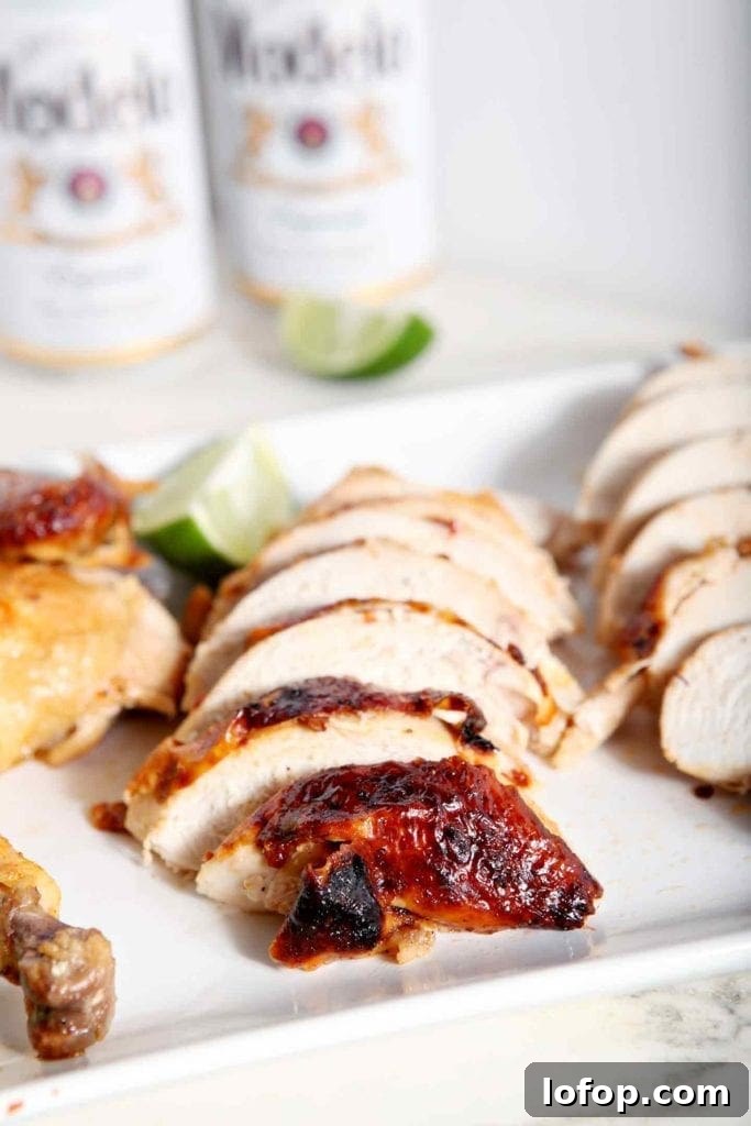 Spicy Chipotle-Lime Beer Can Chicken Recipe 4 sliced chicken on a white plate