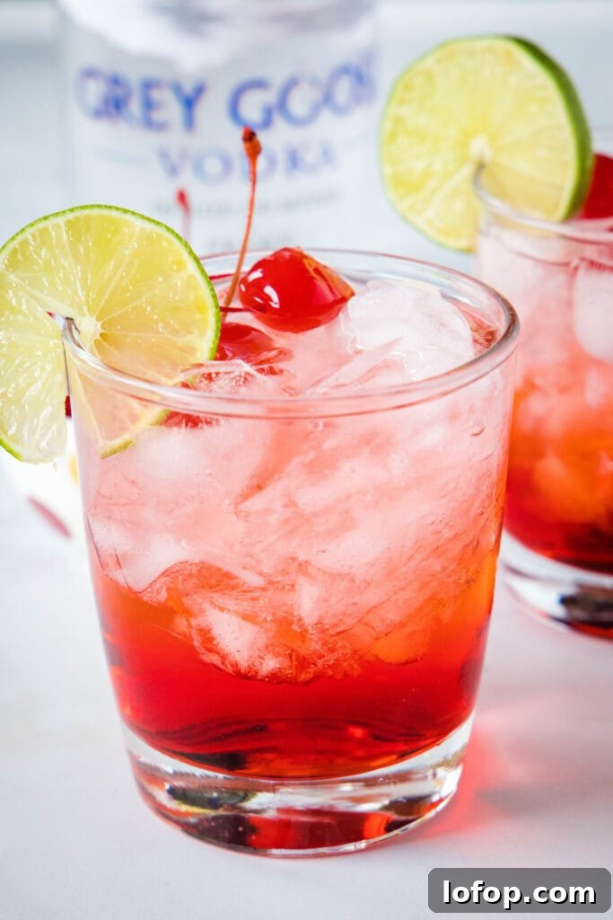 grown up shirley temple in a glass