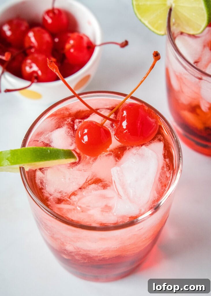 looking down on a glass with a dirty shirley cocktail
