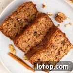 Ultra-Moist Gluten-Free Zucchini Bread with a Secret Ingredient 9 top down image of slices of Extra Moist Gluten Free Zucchini Bread on a plate