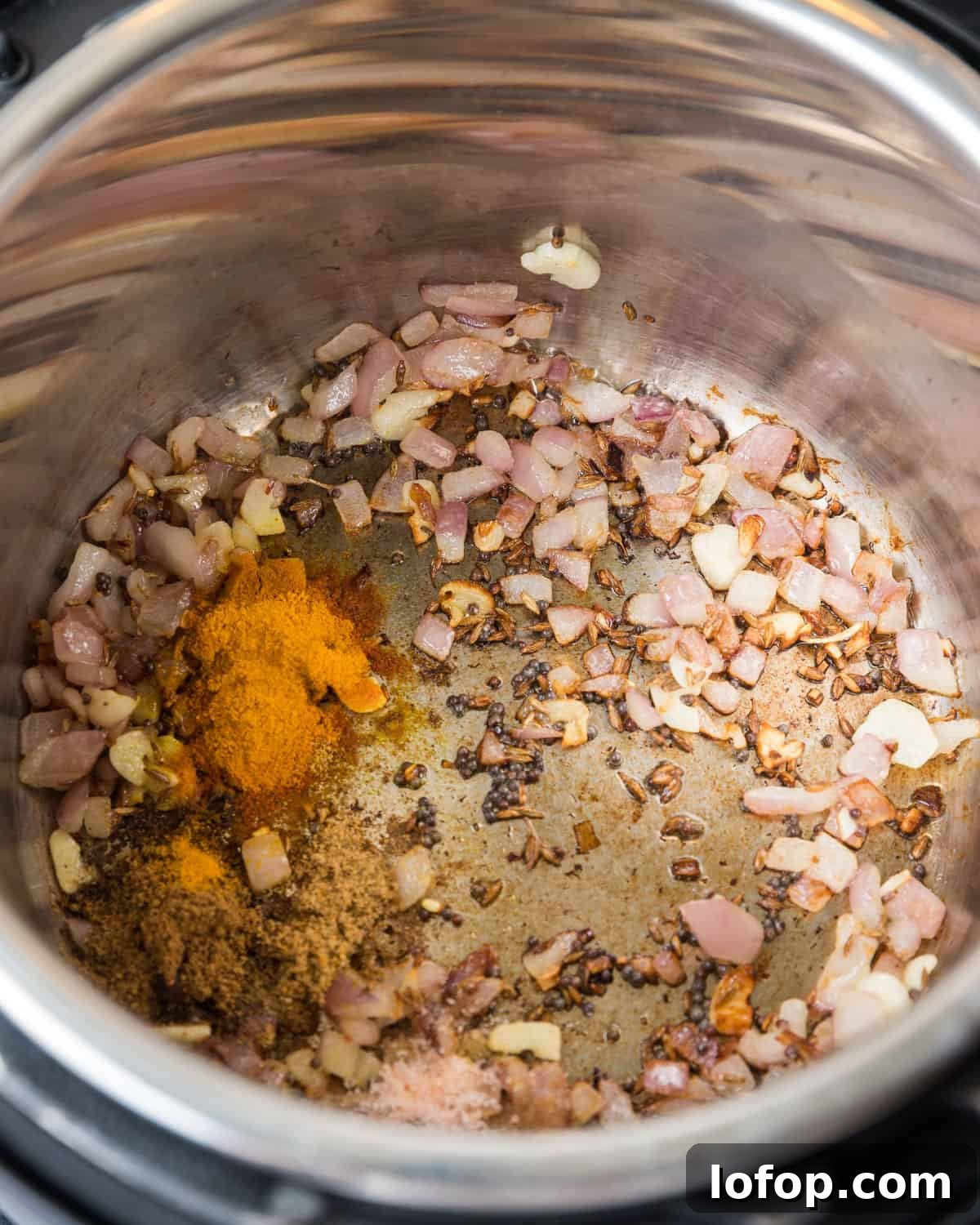 Perfect Instant Pot Mung Beans: Tender, Flavorful Every Time 19 Photo showing more spices being added to the Instant Pot.