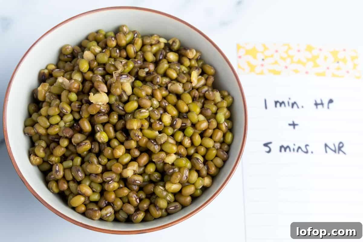 Perfect Instant Pot Mung Beans: Tender, Flavorful Every Time 10 Photo showing a bowl of perfectly cooked mung beans with the label next to it showing 1 minute cook time and 5 minutes natural release.