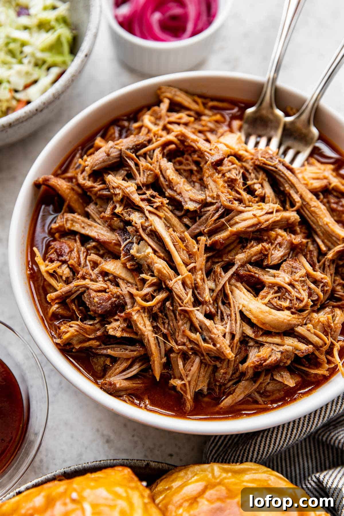 pulled pork in a white bowl.