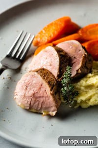 sous vide pork tenderloin on plate close up 1