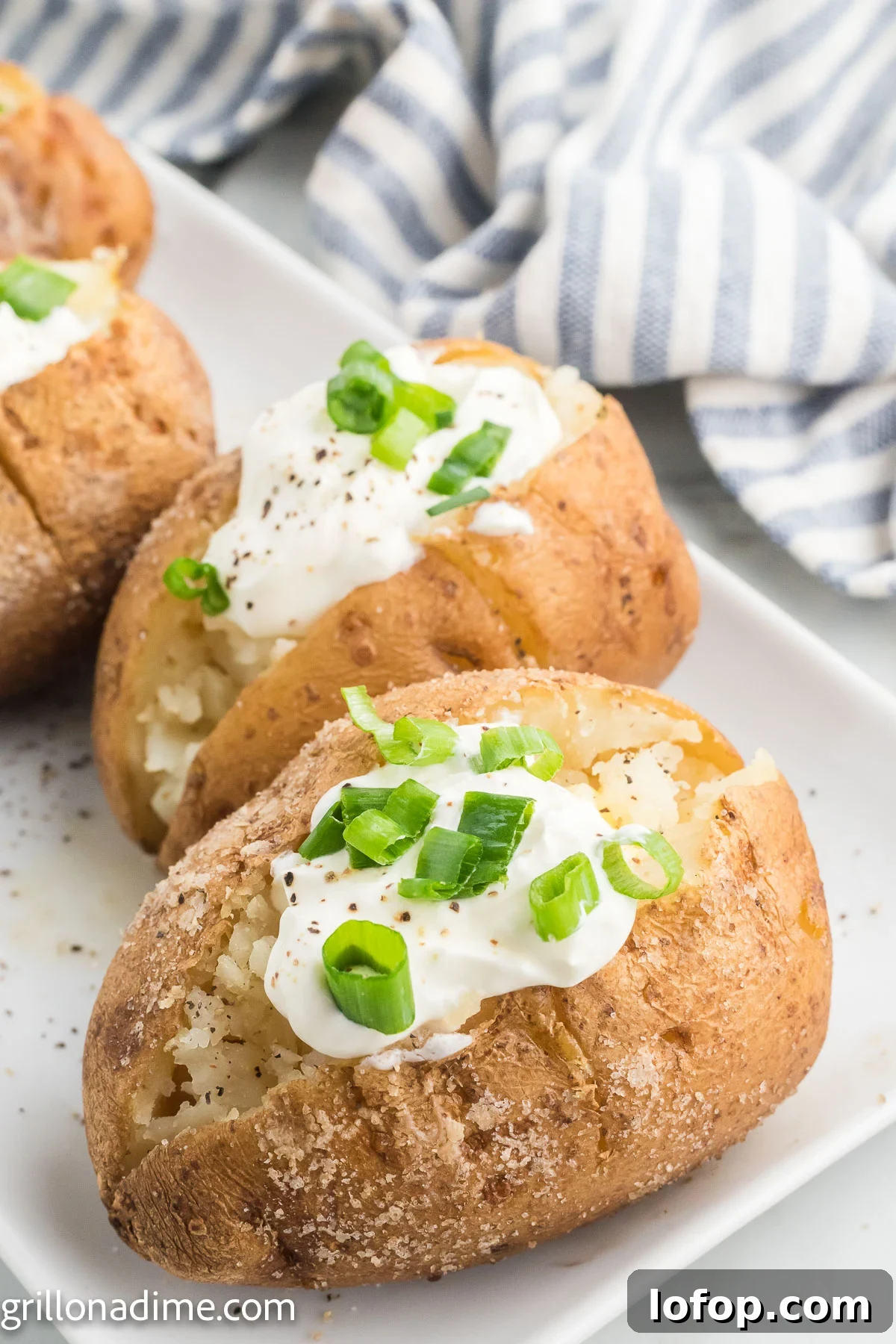 Smoked Baked Potatoes Recipe: Crispy Skins and Tender Centers 8 Smoked baked potatoes topped with sour cream and chives
