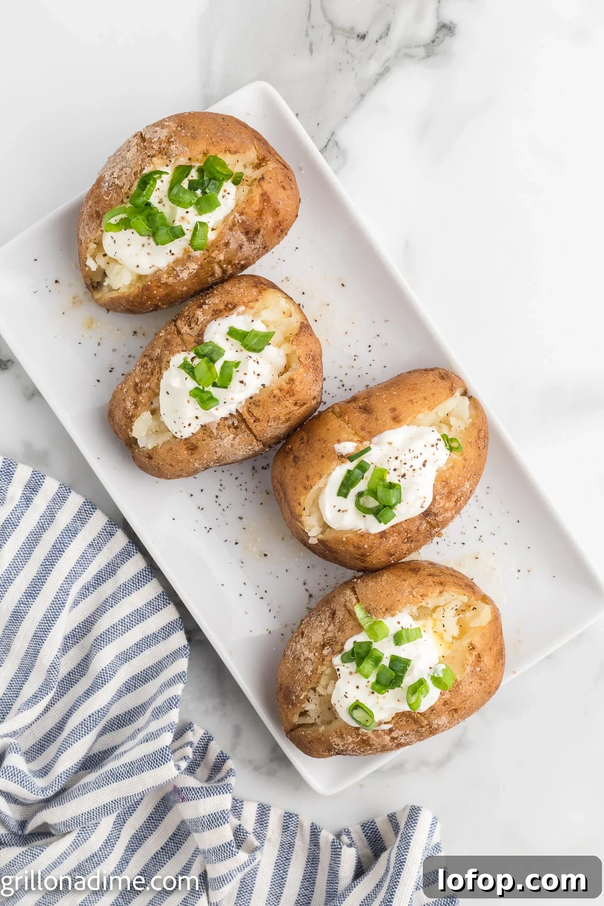 Smoked Baked Potatoes Recipe: Crispy Skins and Tender Centers 9 Smoked baked potato topped with sour cream and chives