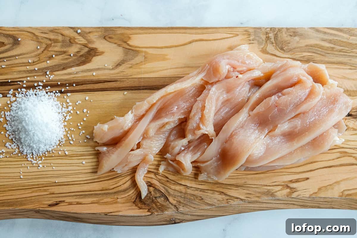 Homemade Turkey Jerky Recipe: Tender, Flavorful & Easy to Make 4 Turkey sliced into jerky strips on cutting board