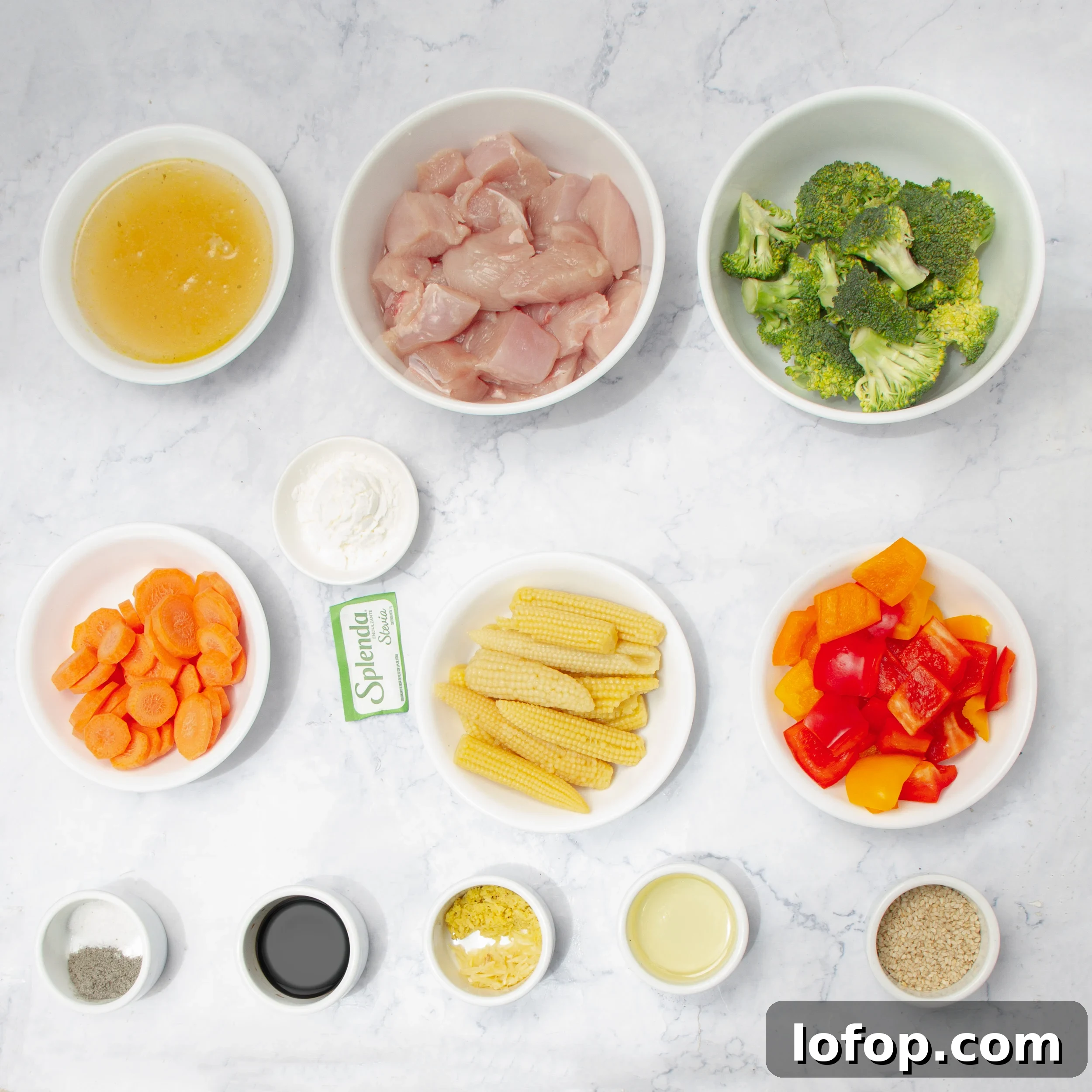 Quick Chicken Stir-Fry with Veggies and Garlic Sauce 3 Healthy chicken stir fry ingredients in separate dishes.