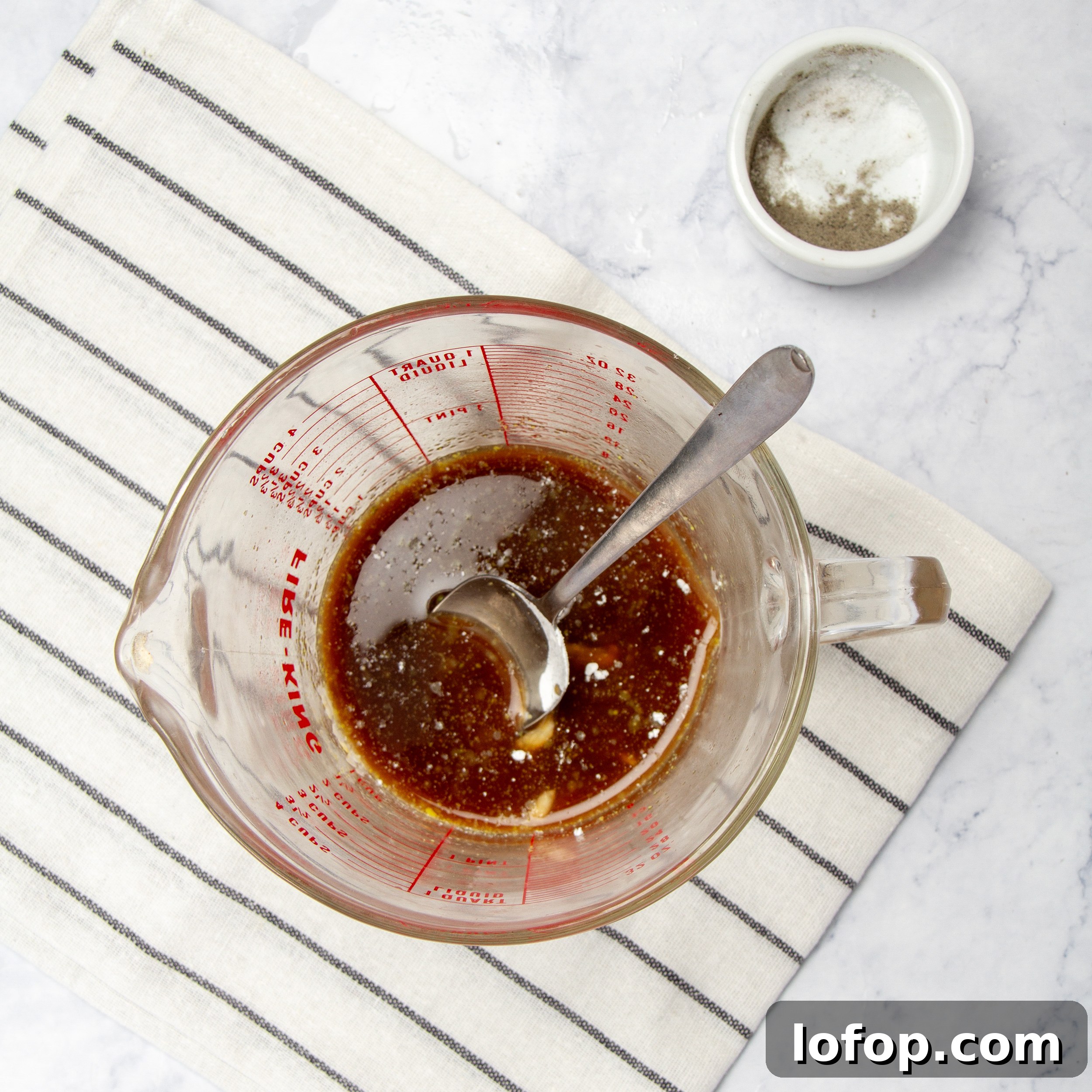 Quick Chicken Stir-Fry with Veggies and Garlic Sauce 5 Sauce ingredients mixed in a small measuring cup.