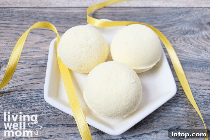 DIY Coconut Bath Bombs for Deep Hydration and Soft Skin 13 DIY Bath Bombs displayed on a glass plate.