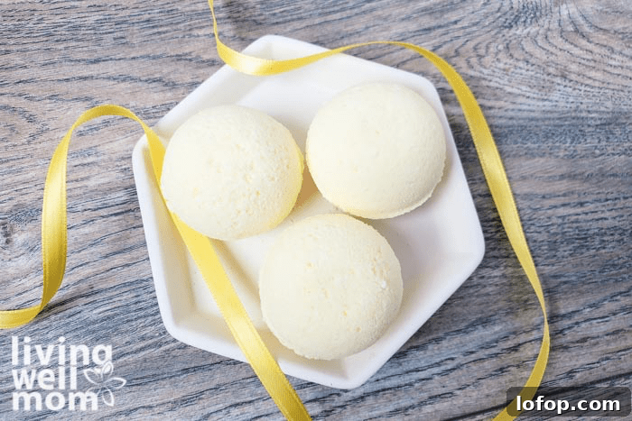 DIY Coconut Bath Bombs for Deep Hydration and Soft Skin 5 A tray of bath bombs with a yellow ribbon surrounding them.