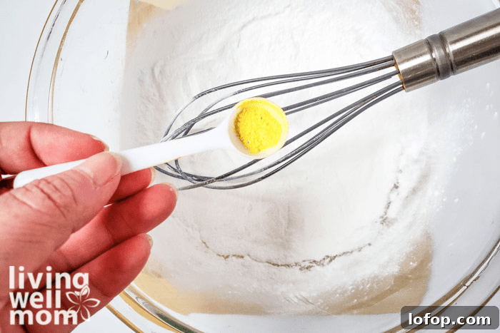 DIY Coconut Bath Bombs for Deep Hydration and Soft Skin 9 A teaspoon of yellow mica powder to add to bath bomb recipe.