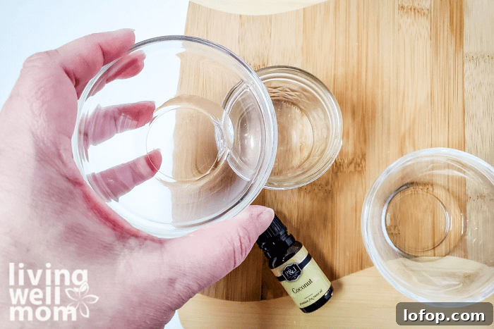 DIY Coconut Bath Bombs for Deep Hydration and Soft Skin 10 Water and coconut oil in small glass bowls.