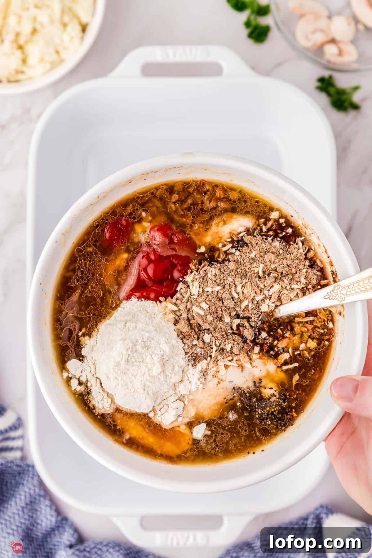 Hearty Salisbury Steak Casserole with Savory Brown Gravy 6 gravy ingredients in a bowl with a spoon