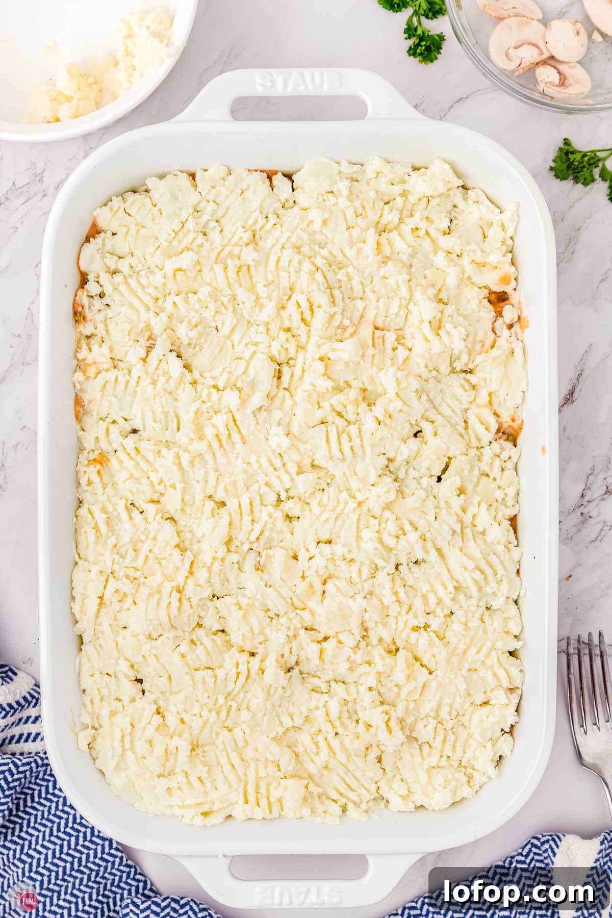 Hearty Salisbury Steak Casserole with Savory Brown Gravy 9 casserole with mashed potatoes on top
