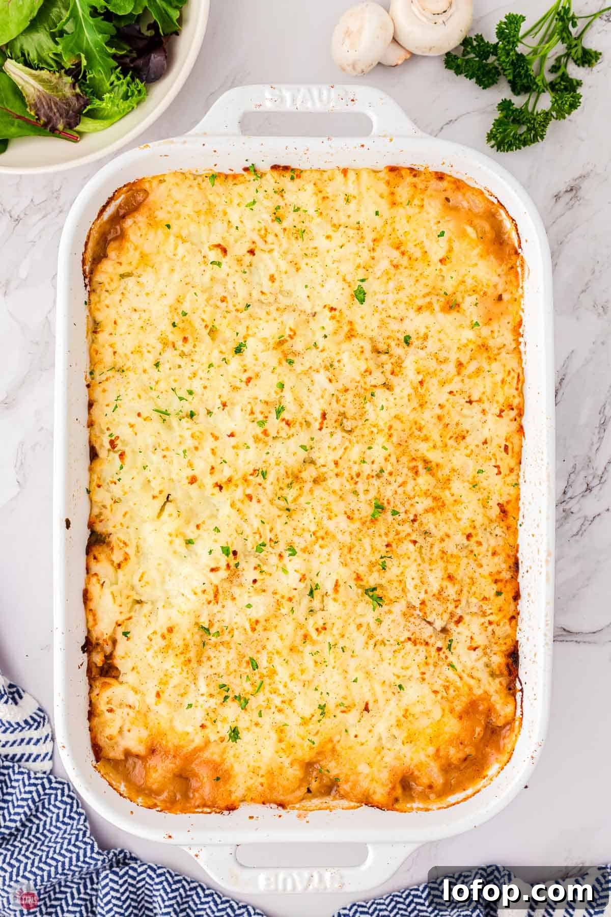 Hearty Salisbury Steak Casserole with Savory Brown Gravy 10 baked salisbury steak casserole in a white baking dish