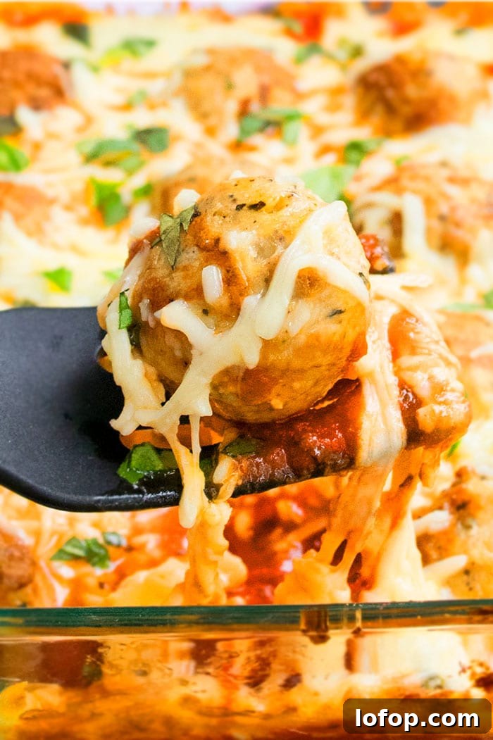 One-Pan Meatball Casserole with Cheesy Tomato Sauce 4 Cheese Pull Shot of Meatball Parmesan