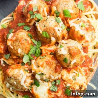 One-Pan Meatball Casserole with Cheesy Tomato Sauce 5 Plate of Easy Meatball Casserole with Basil Garnish