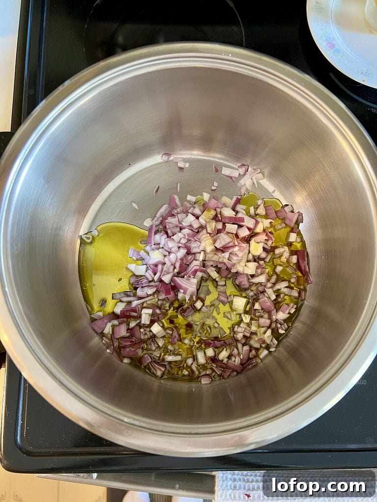 Sautéing the red onion.