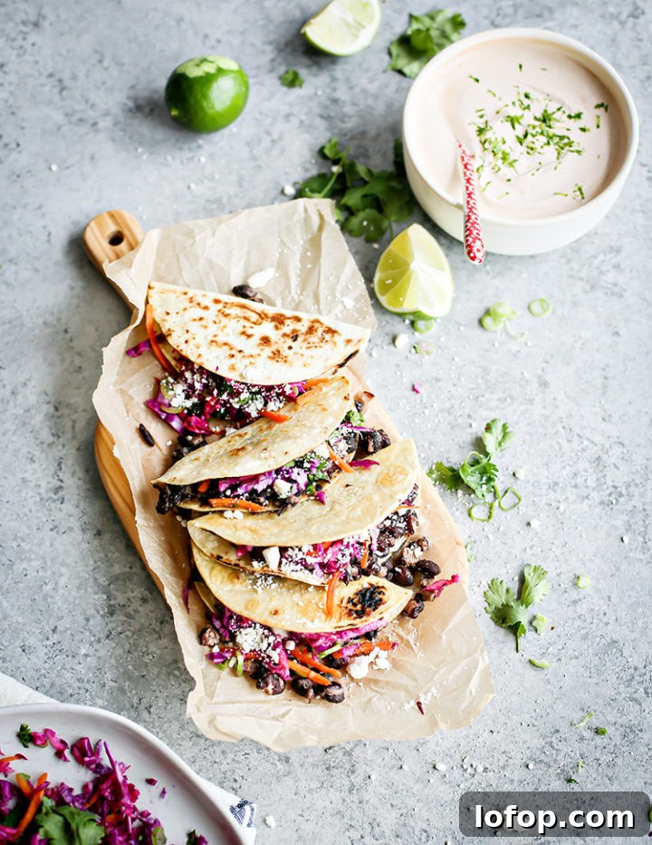 Crispy Black Bean Tacos with Cilantro-Lime Slaw 2 overhead photo of black bean tacos on a cutting board