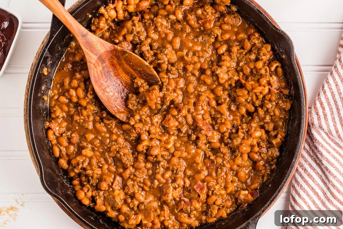 Hearty Baked Beans with Ground Beef — Stovetop, Oven or Slow Cooker 4 Overhead images of baked beans in cast iron skillet.