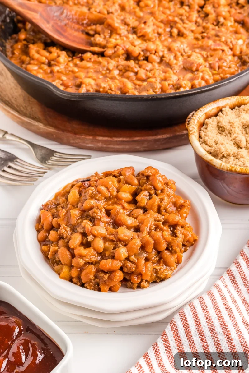 Hearty Baked Beans with Ground Beef — Stovetop, Oven or Slow Cooker 6 Finished dish of baked beans with ground beef.