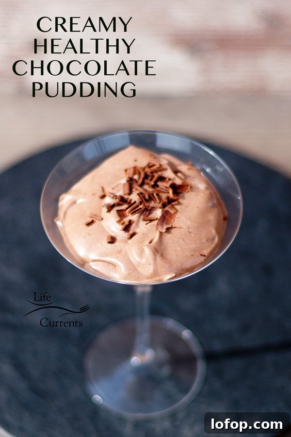 Creamy Cottage Cheese Chocolate Pudding Recipe 11 chococlate pudding in a martini glass with chocolate shavings on top on a black background with a title