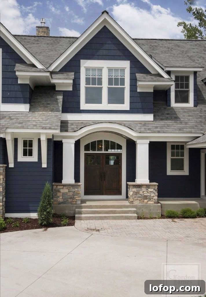 navy house with gray roof shingle color