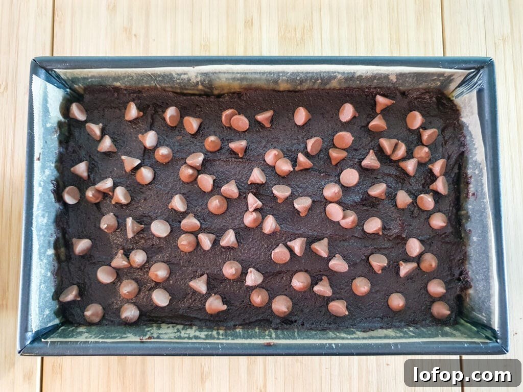 Decadent Egg-Free Brownies Recipe for Fudgy Chocolate Bliss 13 Sprinkling on chocolate chips.