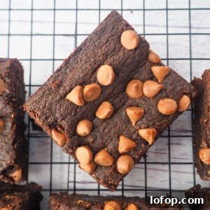 Decadent Egg-Free Brownies Recipe for Fudgy Chocolate Bliss 16 Close up of eggless brownies on a cooling rack.