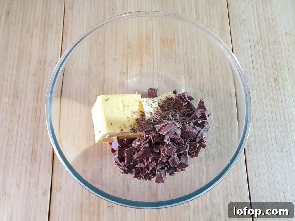 Decadent Egg-Free Brownies Recipe for Fudgy Chocolate Bliss 7 Adding butter and chopped chocolate to a microwave proof bowl.