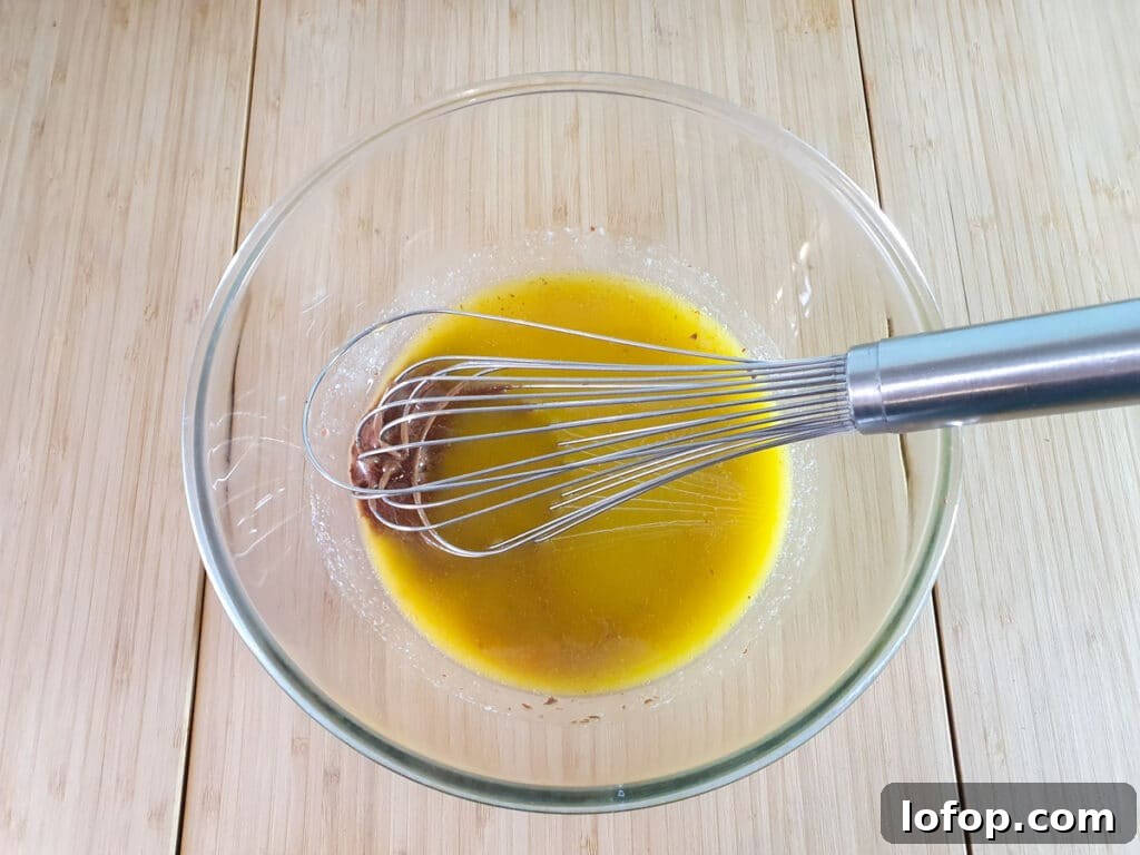 Decadent Egg-Free Brownies Recipe for Fudgy Chocolate Bliss 8 Whisking melted butter and chocolate together.