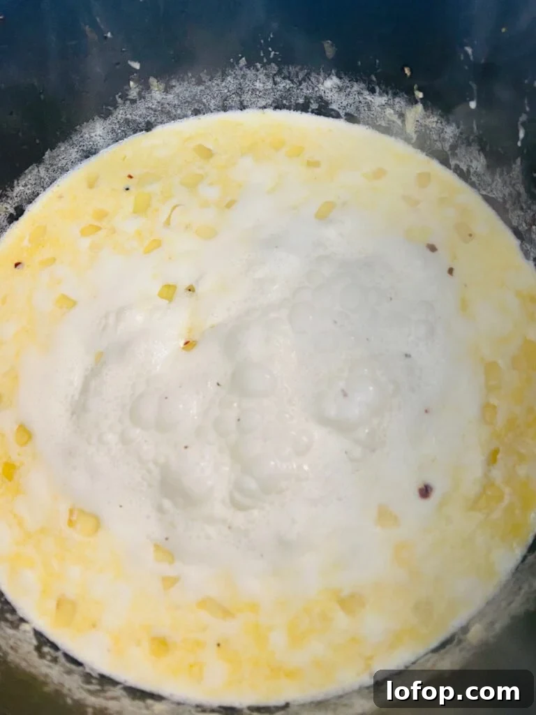 cream boiling in pot