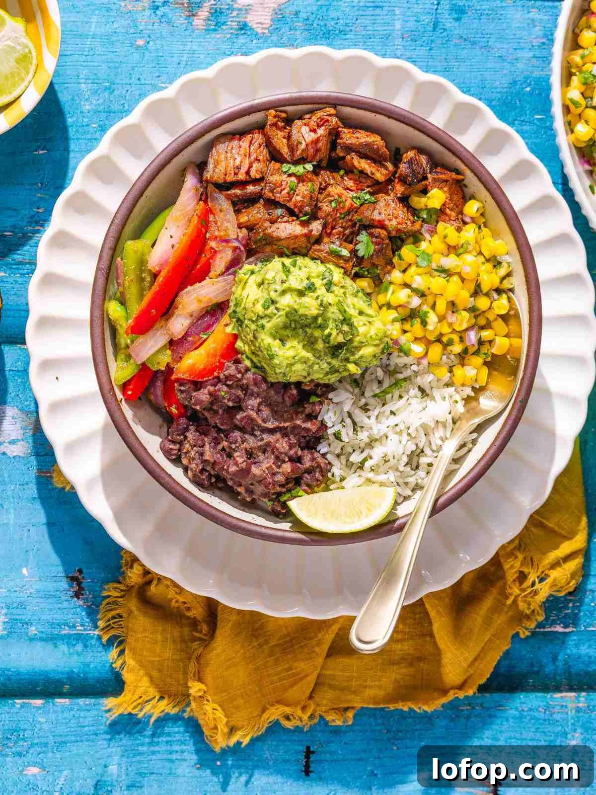 smoky chipotle steak with rice, beans, and vegetables.