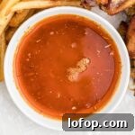 close up of a bowl of cajun butter sauce.