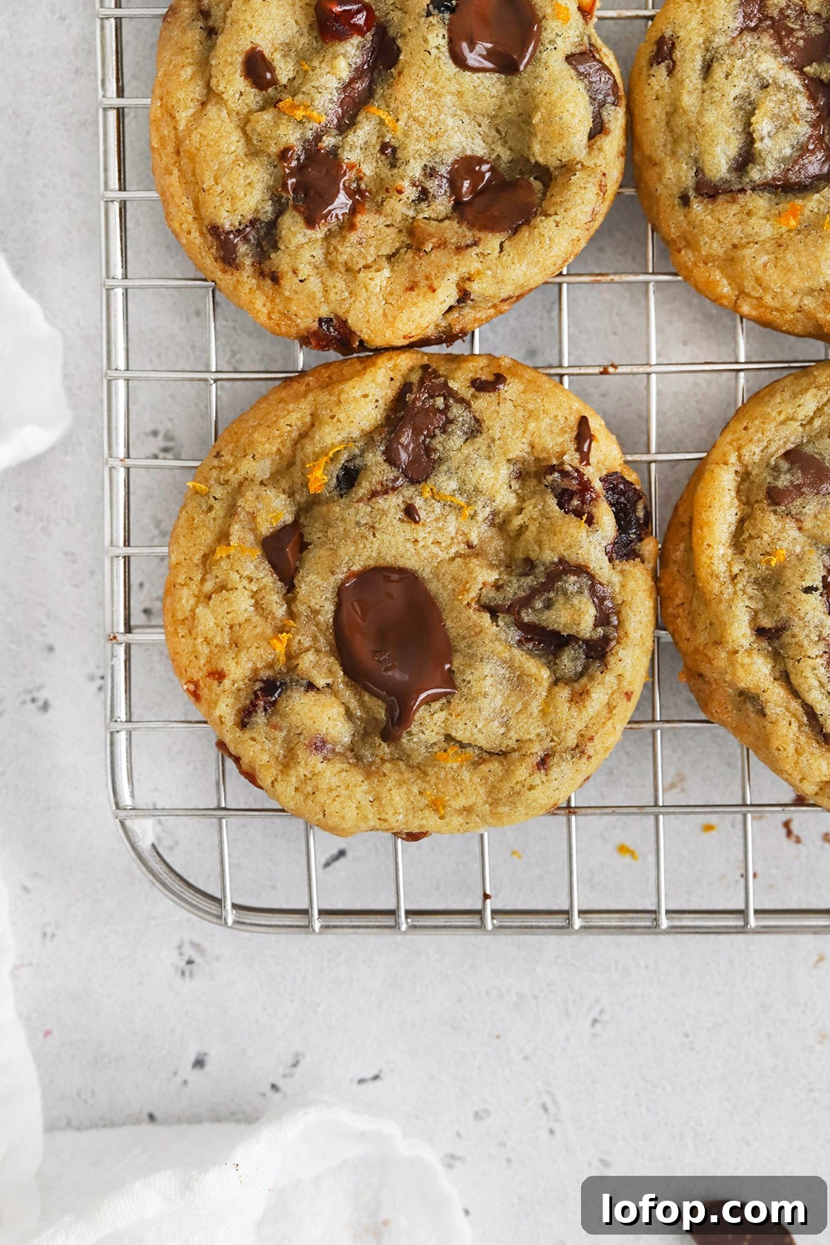 Gluten-Free Orange Cranberry Chocolate Chunk Cookies 2 Overhead view of gluten-free orange cranberry chocolate chip cookies cooling on a cooling rack