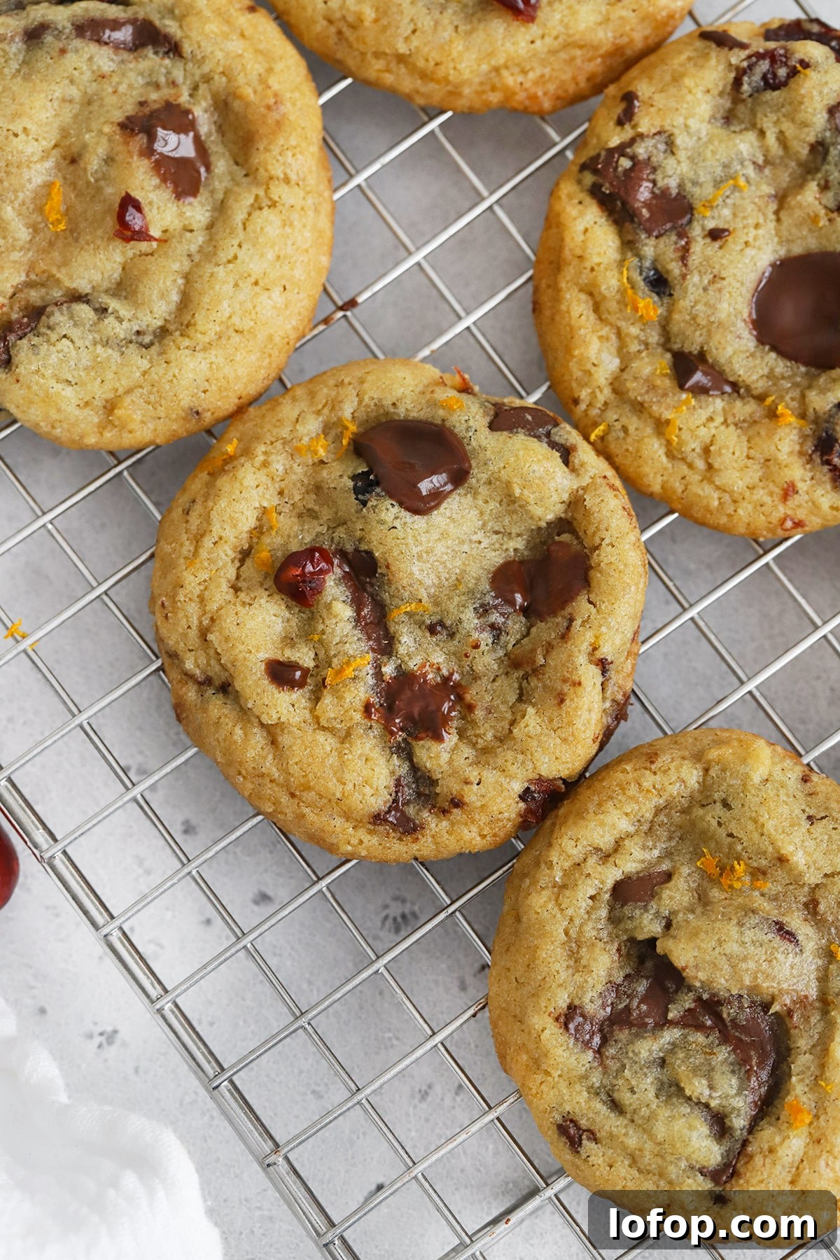 Gluten-Free Orange Cranberry Chocolate Chunk Cookies 13 Overhead view of gluten-free orange cranberry chocolate chip cookies cooling on a cooling rack