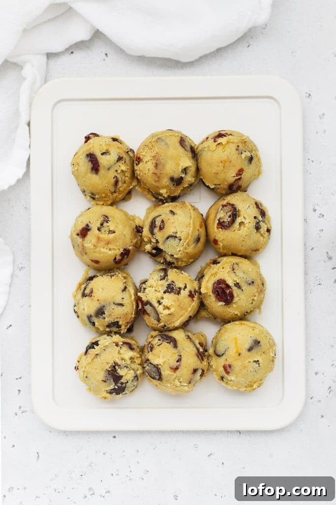 Gluten-Free Orange Cranberry Chocolate Chunk Cookies 9 Scooped balls of gluten-free orange cranberry chocolate chip cookie dough