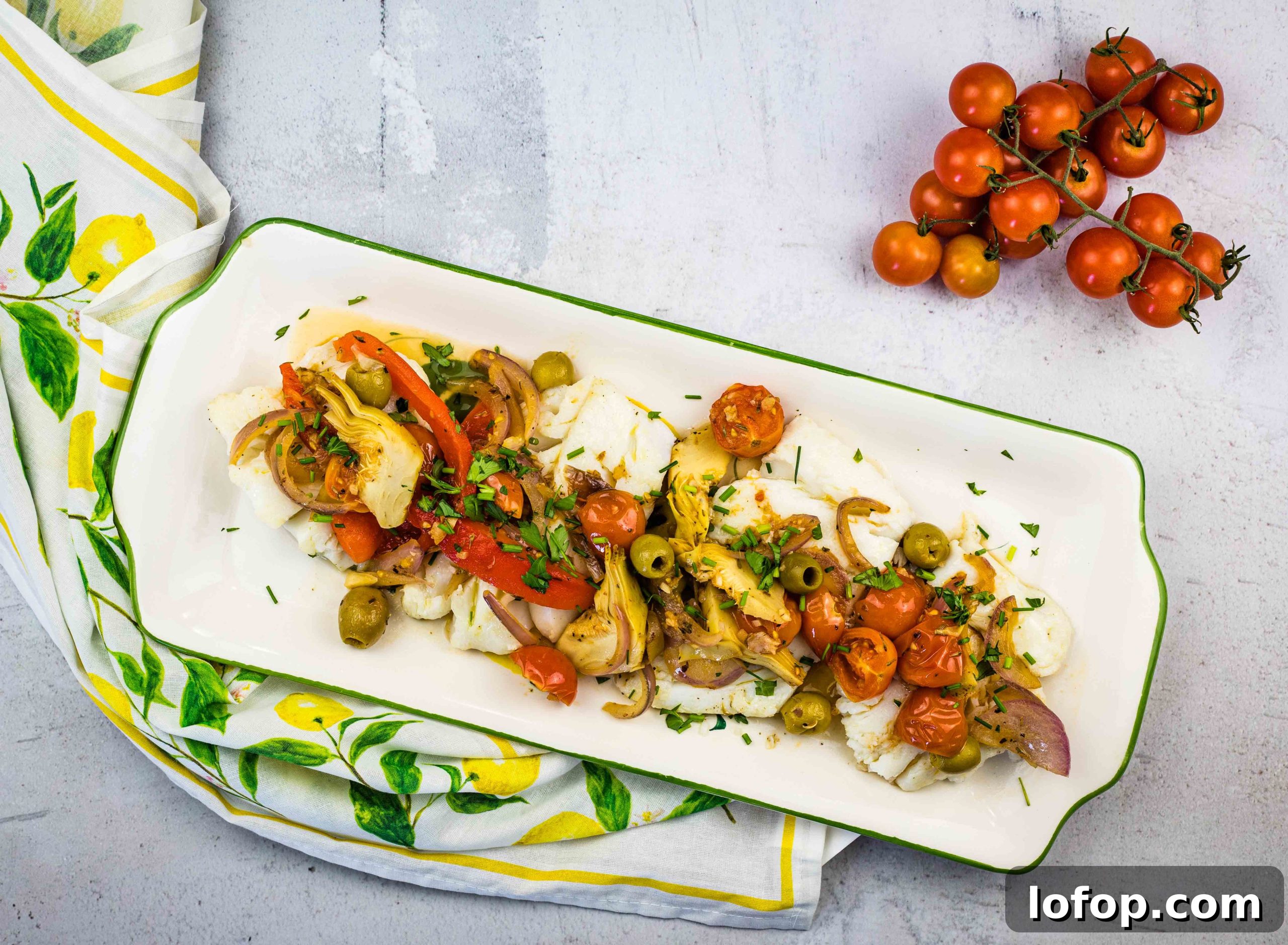 31 Irresistible Seafood Dinners to Add Fish to Your Weekly Menu 3 Mediterranean cod on a rectangular platter.