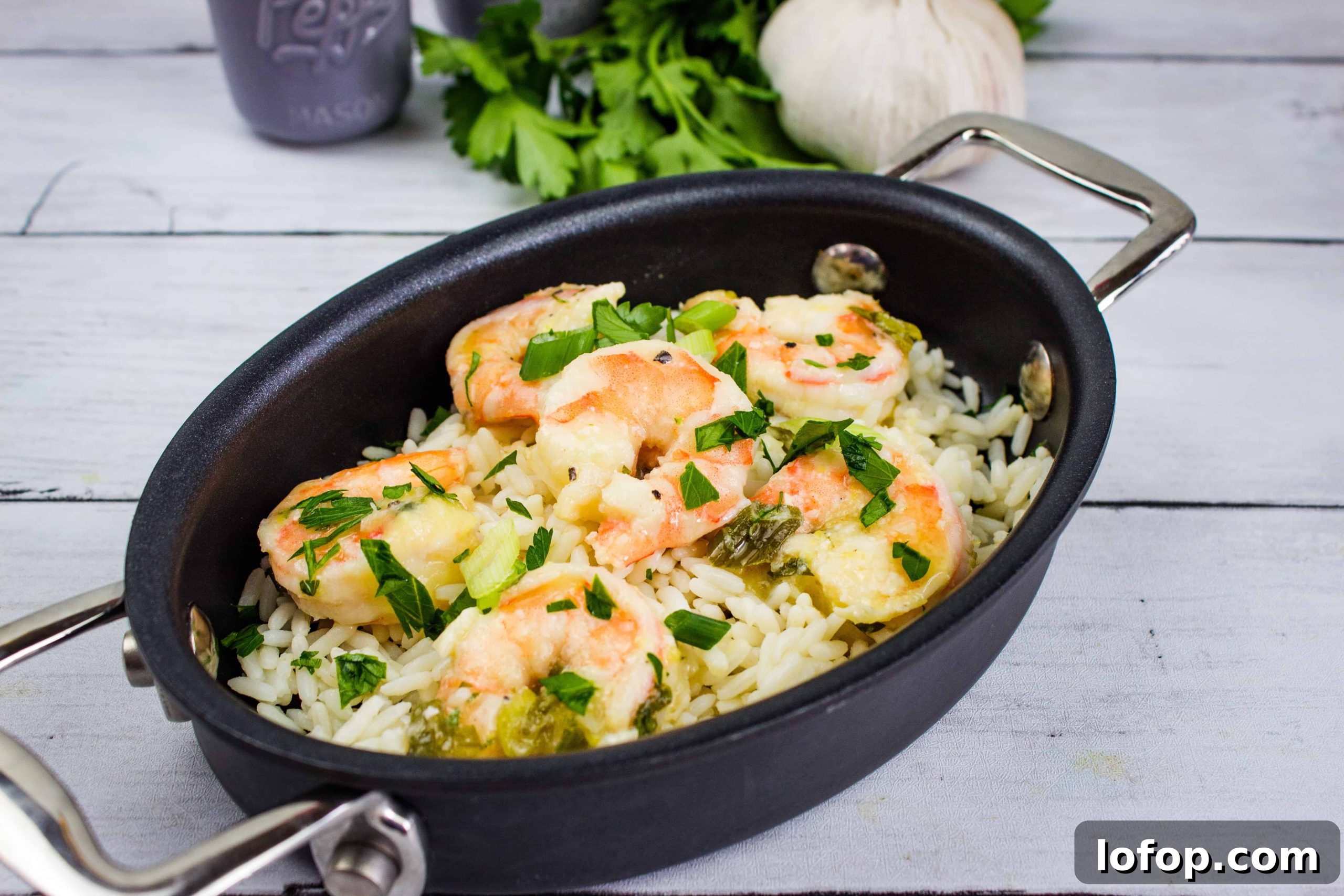 31 Irresistible Seafood Dinners to Add Fish to Your Weekly Menu 30 Fresh shrimp with rice, herbs, and vegetables in a black cooking skillet. Perfect for quick, flavorful meals.