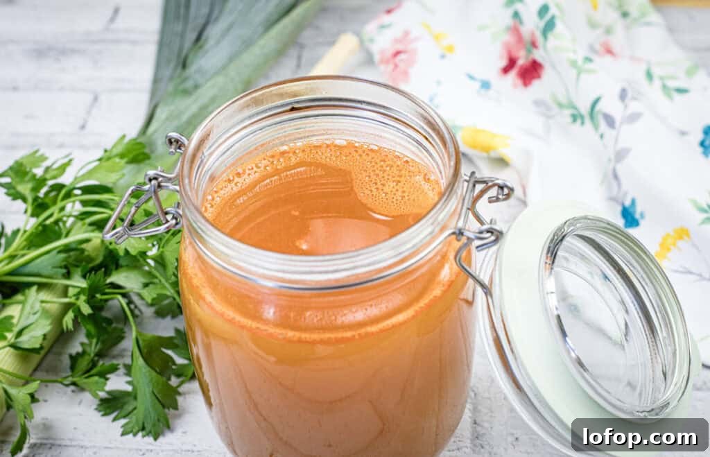 31 Irresistible Seafood Dinners to Add Fish to Your Weekly Menu 4 A glass jar filled with shrimp stock.