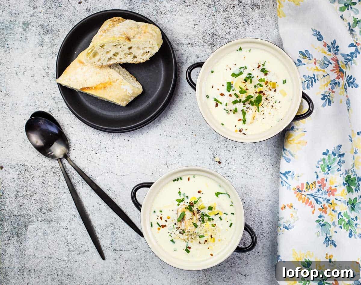 31 Irresistible Seafood Dinners to Add Fish to Your Weekly Menu 31 Cullen Skink in two bowls with crusty bread in the background.