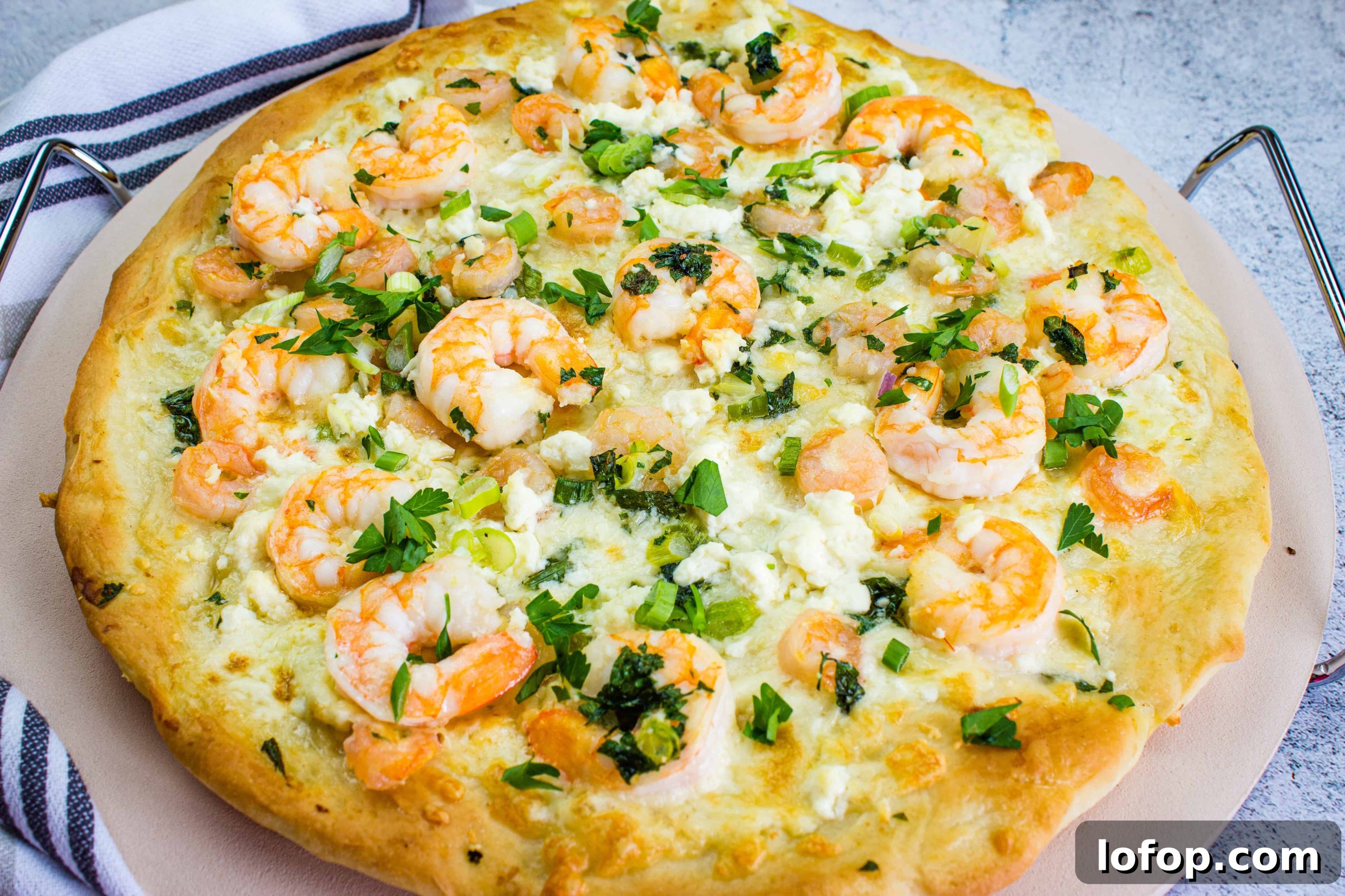 31 Irresistible Seafood Dinners to Add Fish to Your Weekly Menu 10 A pizza with shrimp and cheese on top.
