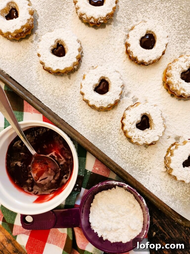 Raspberry Linzer Cookies are buttery almond shortbread, sweet raspberry jam, and zero stress. These are classic European-style holiday sandwich cookies that look fancy but are surprisingly easy to make.
