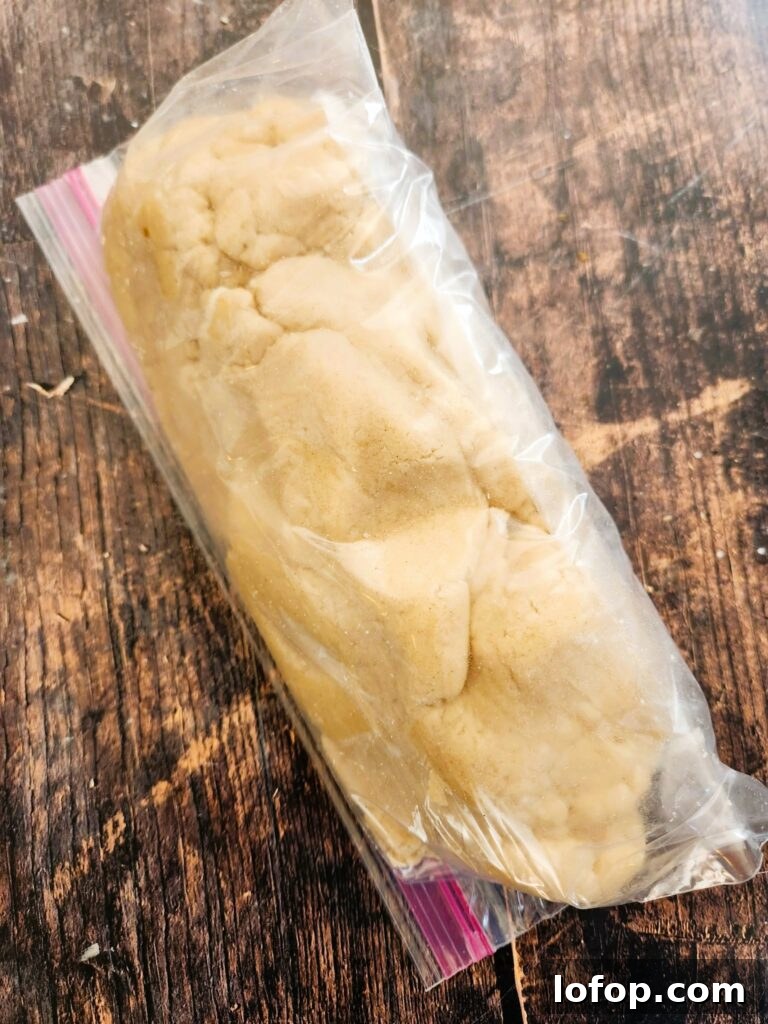 adding linzer dough to a zip bag to chill for 1 hour