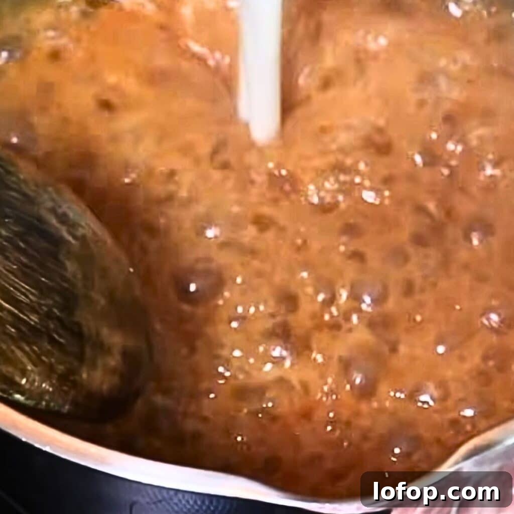 adding hot heavy cream to the caramel