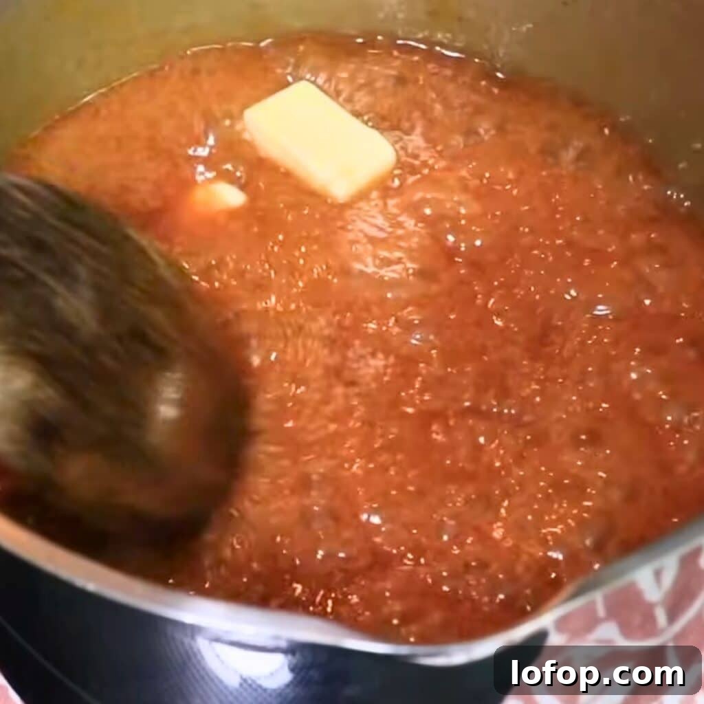 Adding butter and salt to the caramel sauce